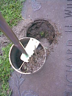 Lift the Cemetery Vase Clean Out Tool put of the vase, dump out and repeat as necessary