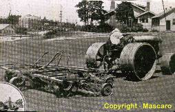 Horse drawn mower converted for tractor use.