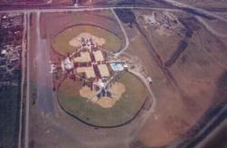 An aerial view of a municipal six field complex outside San Antonio, TX with six softball diamonds set up in a unique pattern.