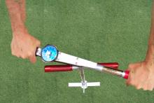 While pressing firmly down on the Turf-Tec Shear Strength Tester, turn the torque tool using both handles toward the follower needle.  When the turf starts to tear, this is the highest number you will see on the follower needle.