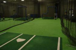 Here is the indoor batting cages at the University of Florida.  These cages can be used totally closed or large garage doors can be opened to allow sunlight and air into the facility.